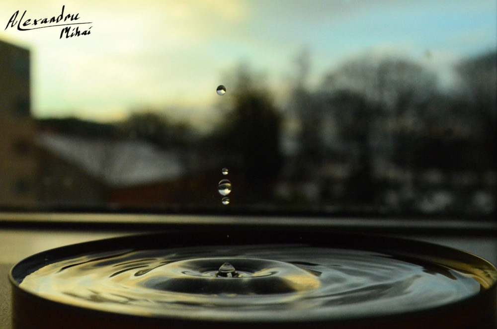 Droplet with golden bokeh